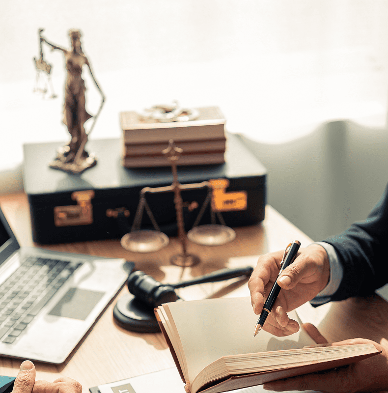 Lawyer writing notes in office
