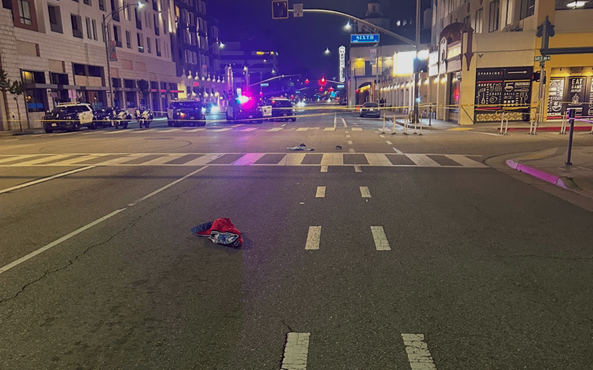 Downtown street at night with police lights