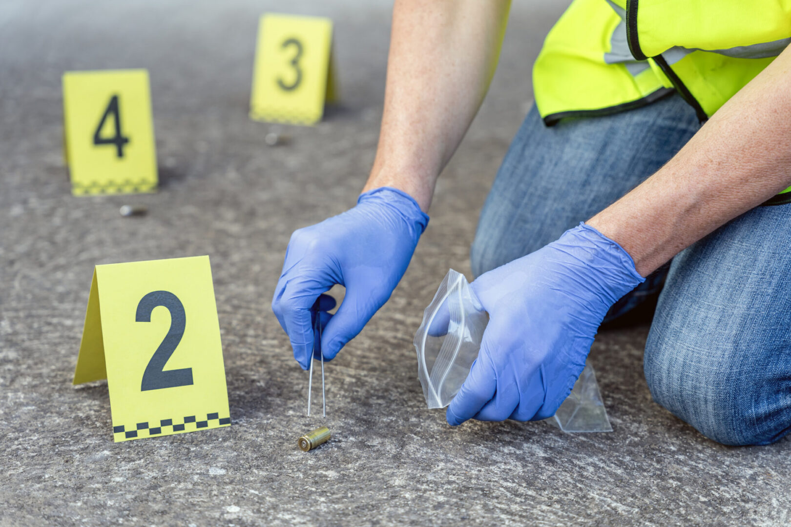 Investigator gathering evidence at crime scene