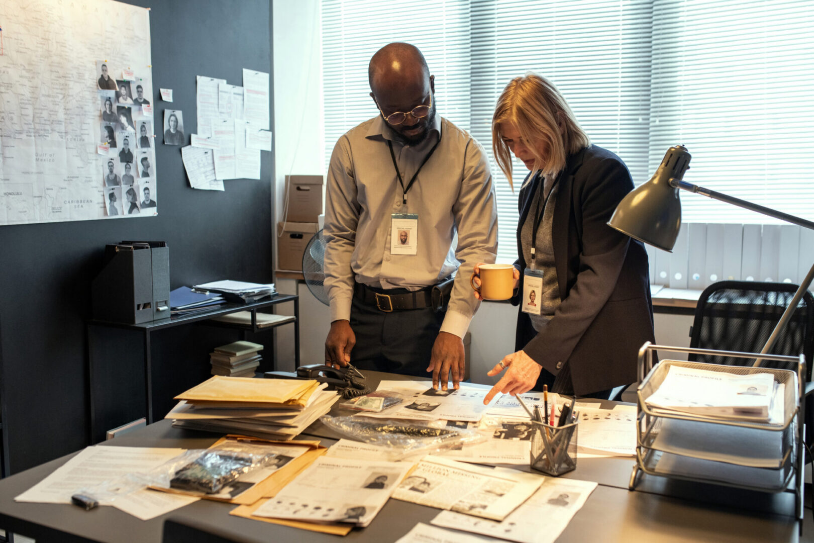 Police officers analyzing case files