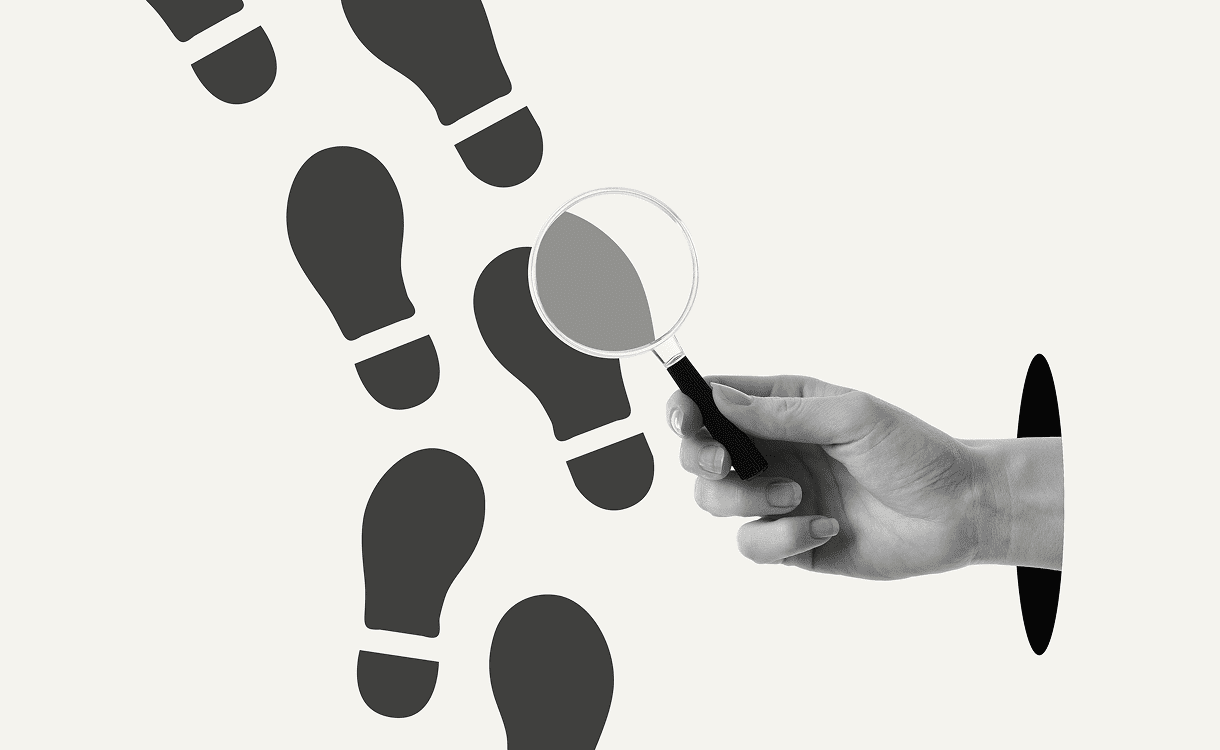 Magnifying glass examining footprints