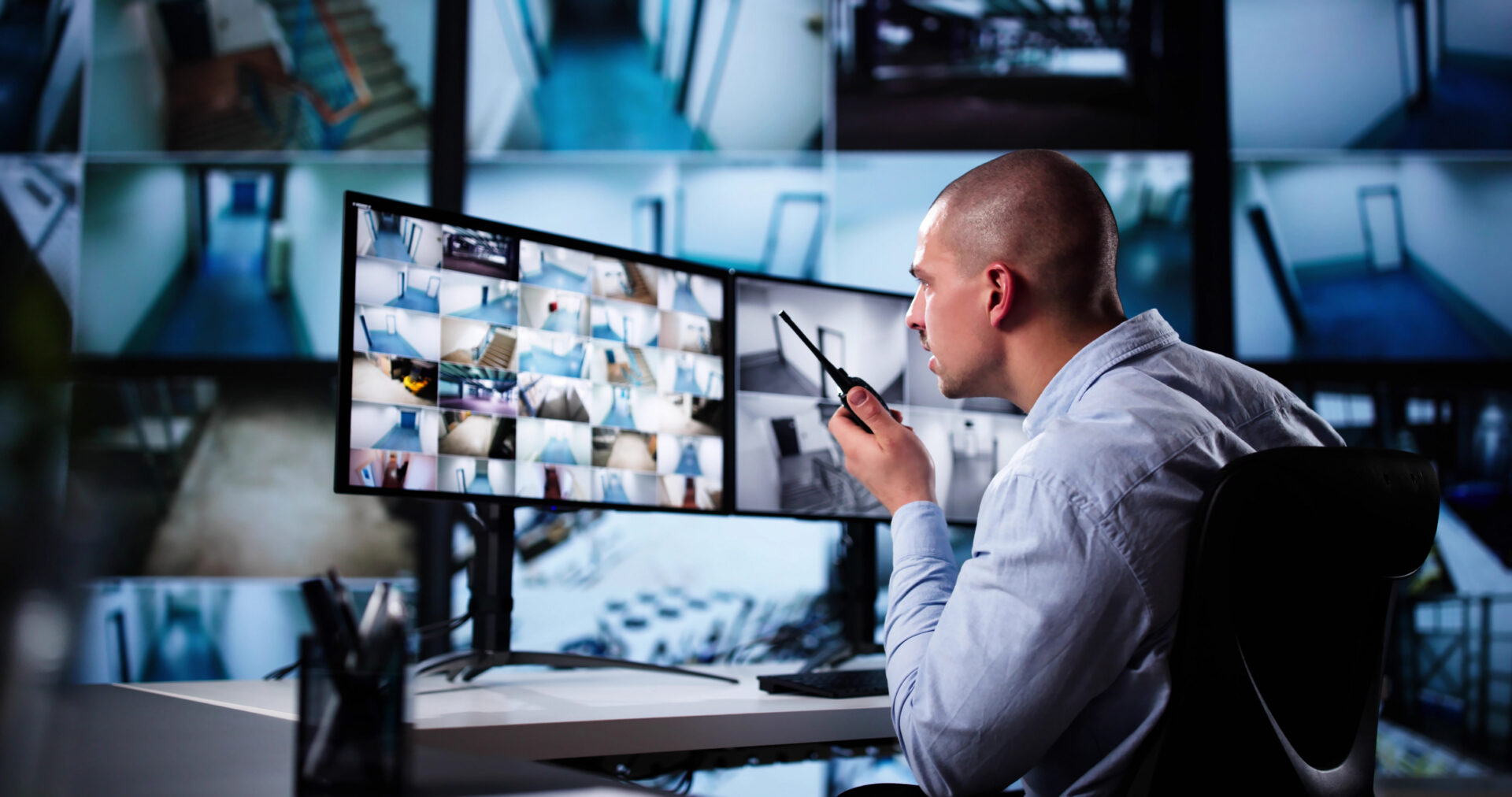 Security guard monitoring surveillance footage