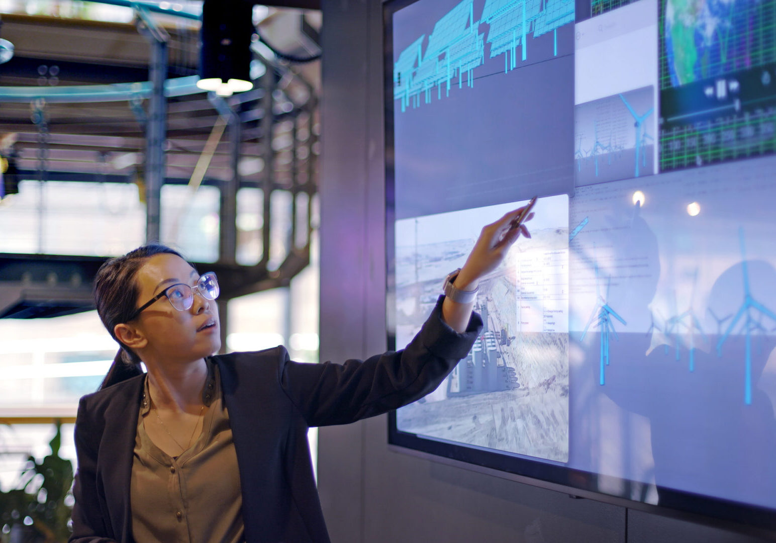 Businesswoman pointing at presentation display